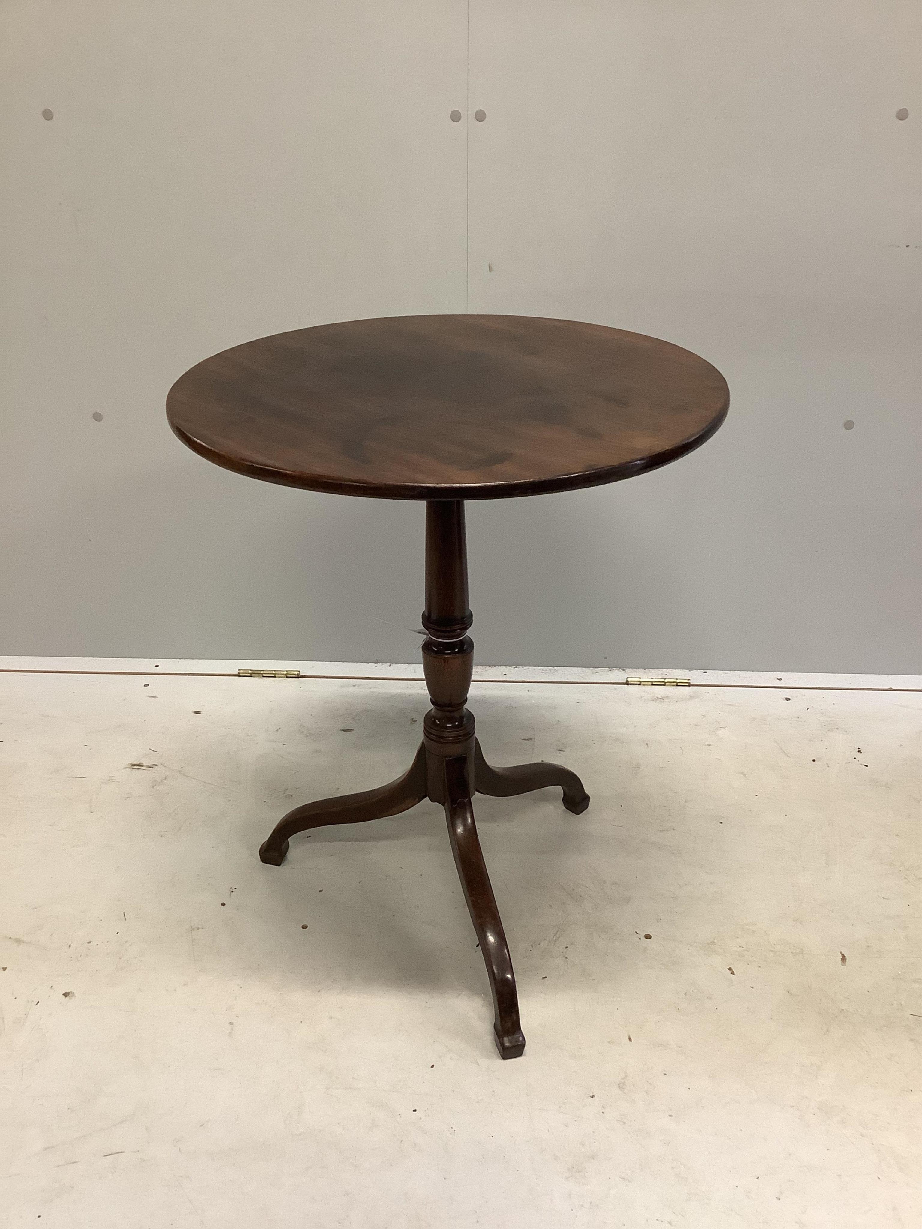 A George III circular mahogany tripod wine table, diameter 55cm, height 70cm. Condition - fair